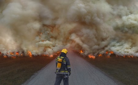 firefighter-standing-in-front-of-wildfire_1200x740.jpg